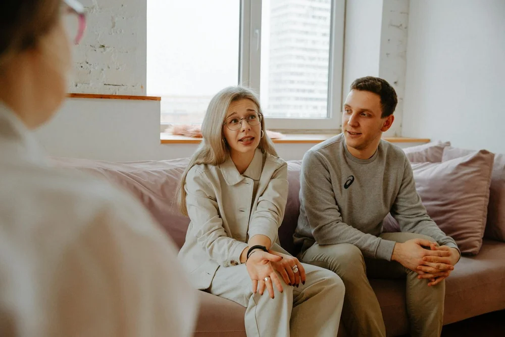 A couple speaking with a counselor